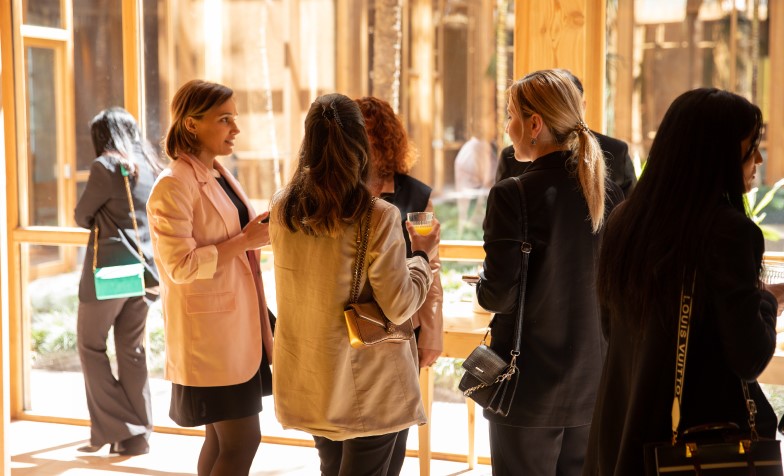 A group of women standing in a line 
Description automatically generated