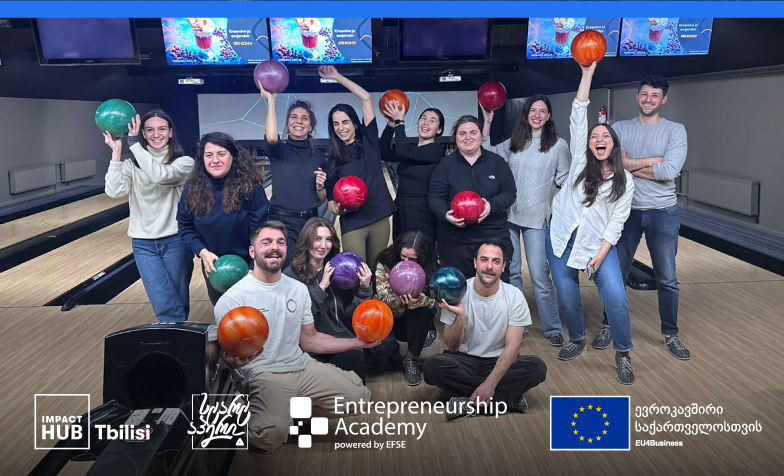 A group of people posing for a photo
Description automatically generated