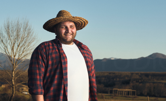 A person wearing a hat
Description automatically generated