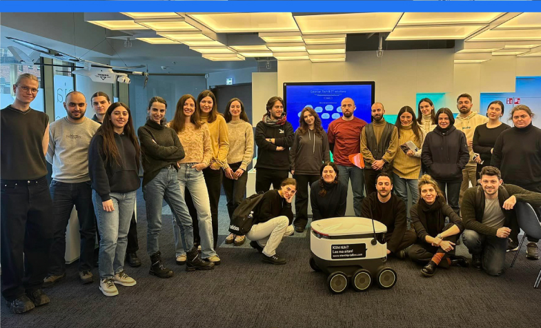 A group of people posing for a photo
Description automatically generated